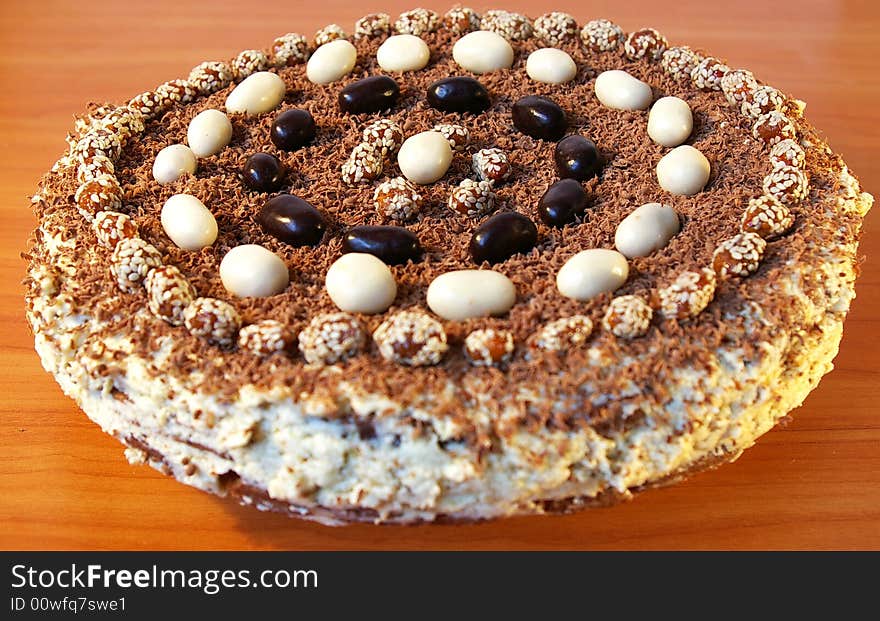 The celebratory ornate chocolate cake on a table