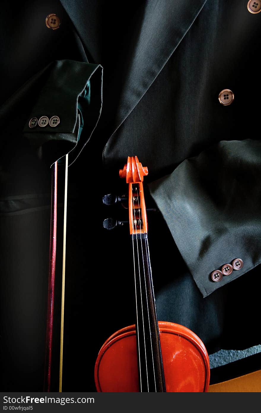 Antique violin with some chalk on a black backgound