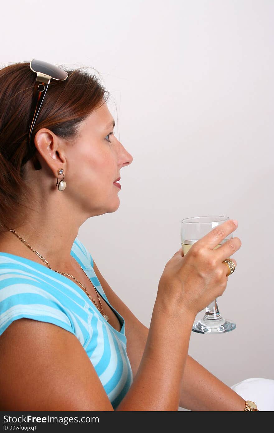 Adult Female Model wearing a striped blue top. Adult Female Model wearing a striped blue top