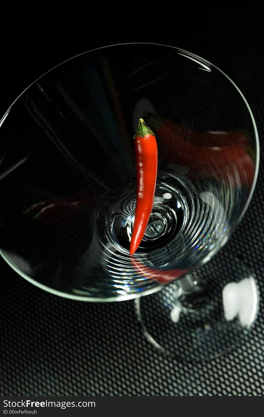 Paprika in glass on black background. Paprika in glass on black background