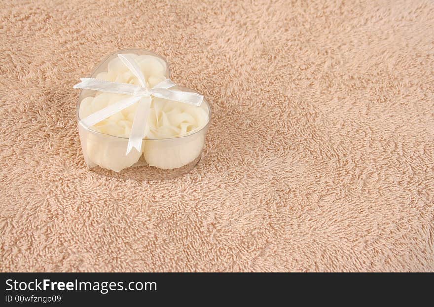 Beige flowers made out of Soap in a heart shaped box. Beige flowers made out of Soap in a heart shaped box