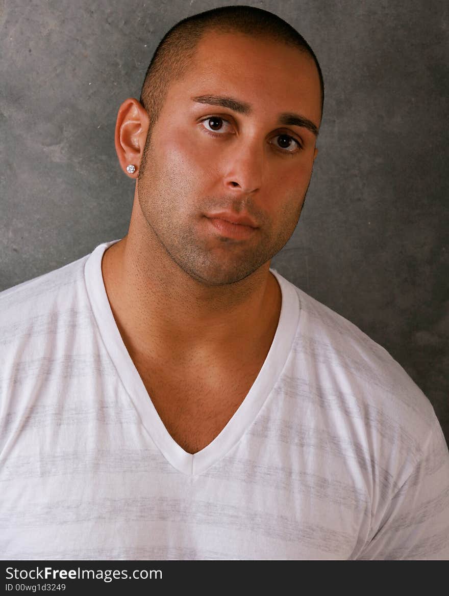 Attractive young Man against cocrete wall. Attractive young Man against cocrete wall