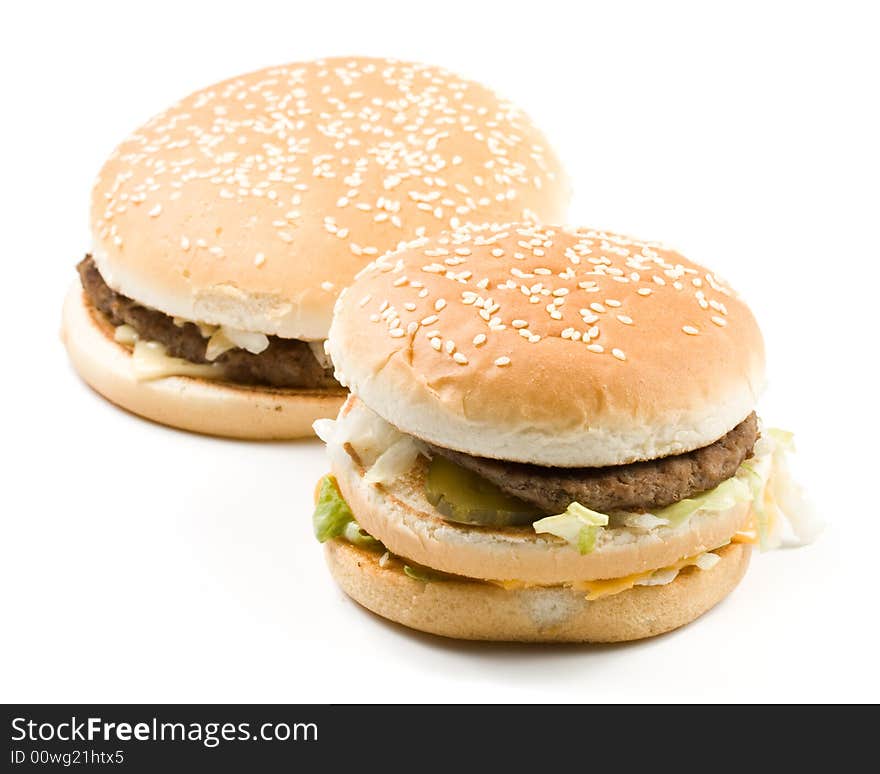 Bread with fried meat, cheese, onion, lettuce and measuring tape isolated on a white background. Bread with fried meat, cheese, onion, lettuce and measuring tape isolated on a white background.