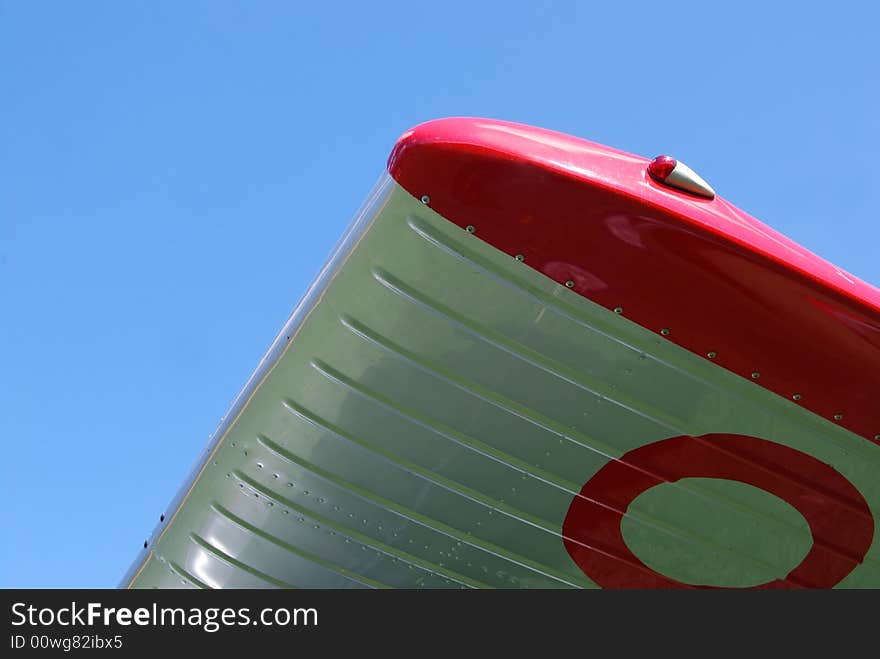 Reflection at an old ariplane with blue sky