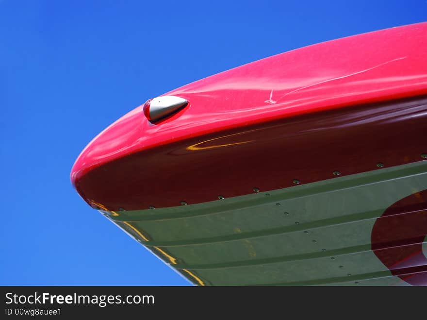 Reflection at an old ariplane with blue sky