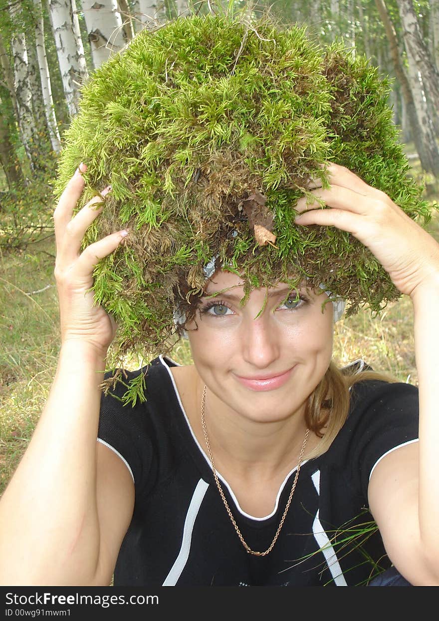 Girl with a moss on a head. Girl with a moss on a head