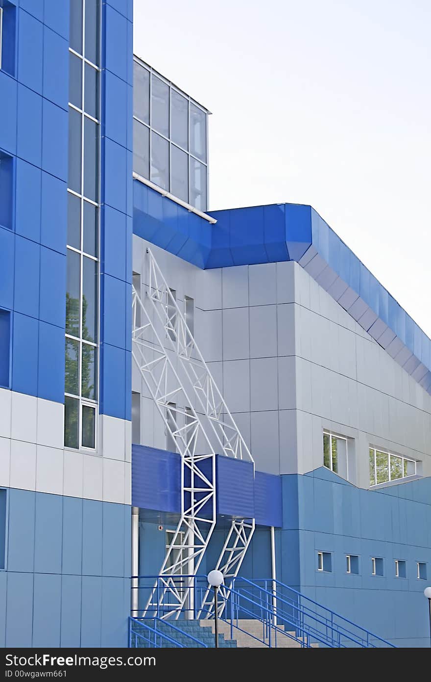 New multistoried building on a background blue sky, social habitation