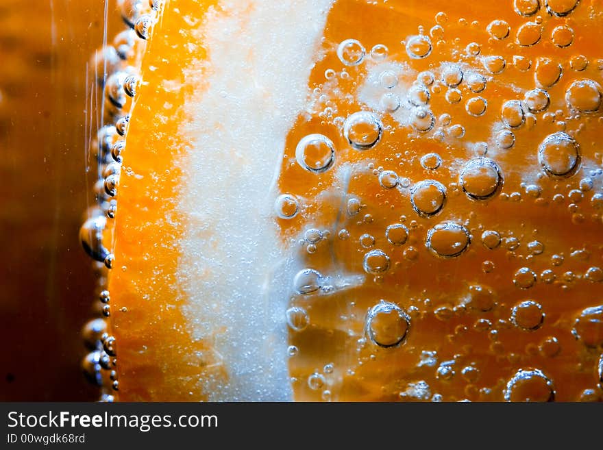 Sparkling fruit in fizzy bubbling water, great for backgrounds and health material. Sparkling fruit in fizzy bubbling water, great for backgrounds and health material.