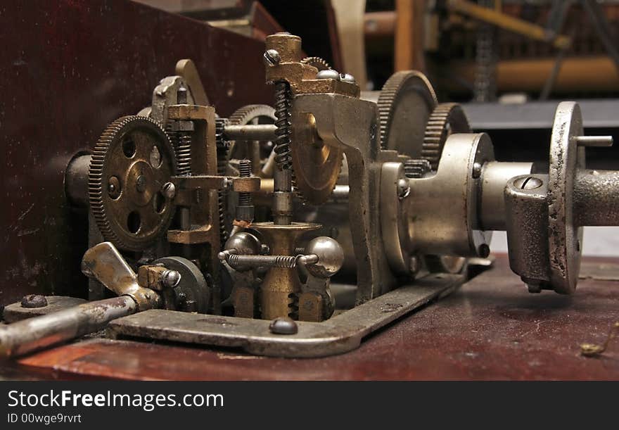 Old clock-work mechanism with cog wheels.