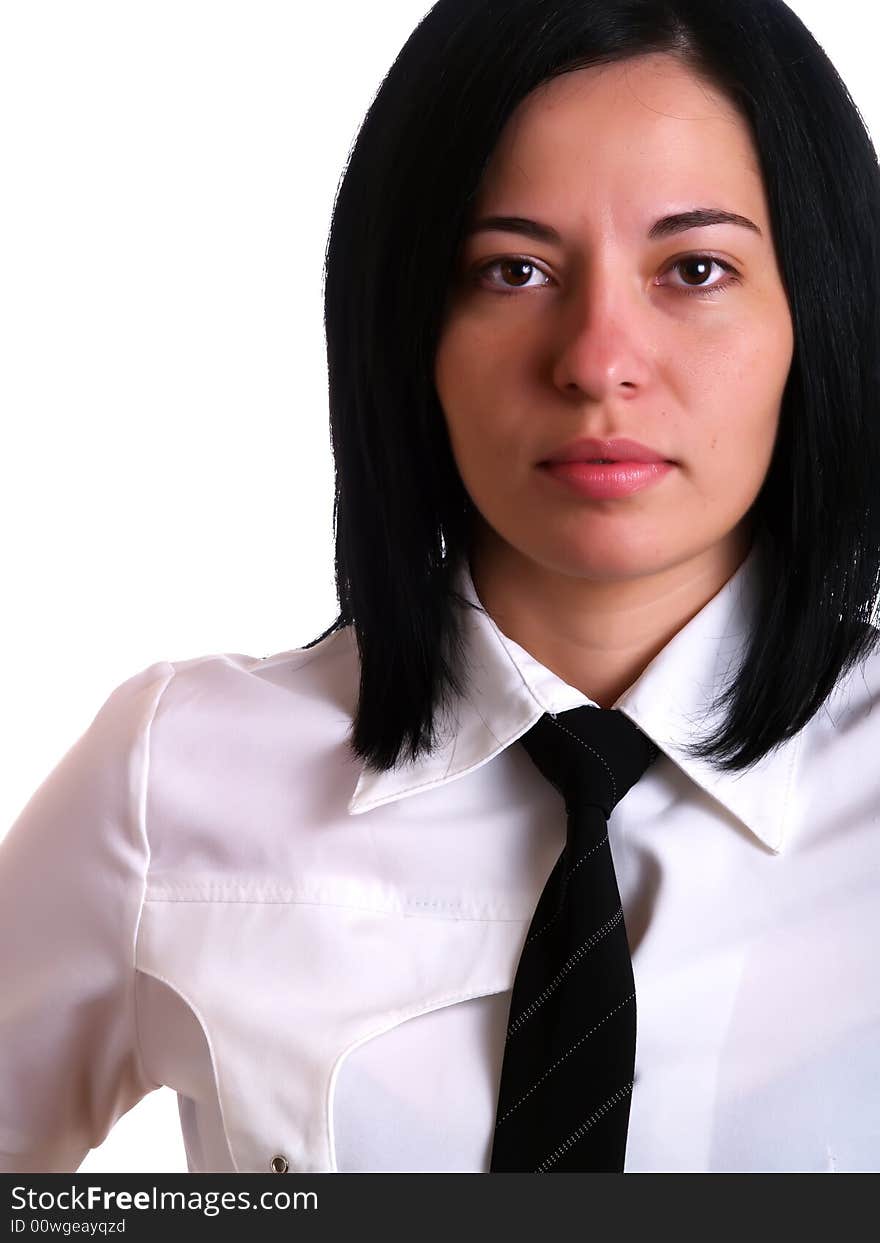 A portrait about a young pretty businesswoman with black hair, she wears a white shirt and a black tie