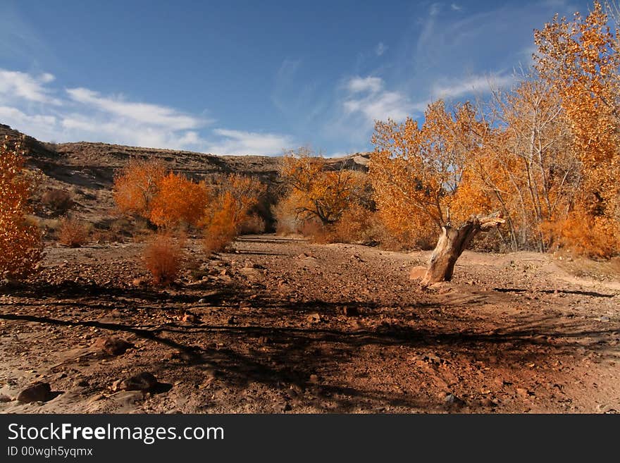 View of the red rock formations in San Rafael Swell with blue sky�s and clouds. View of the red rock formations in San Rafael Swell with blue sky�s and clouds