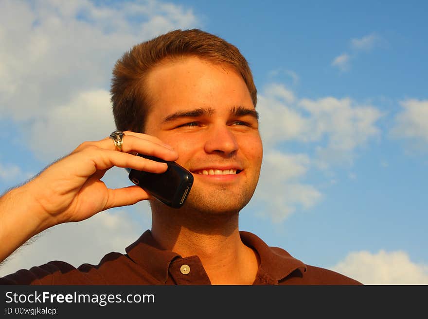 Attractive young man on a cell phone. Attractive young man on a cell phone