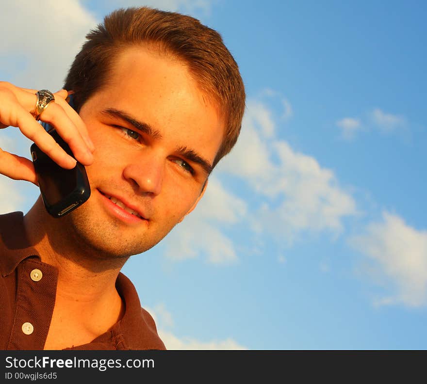 Attractive young man on a cell phone. Attractive young man on a cell phone