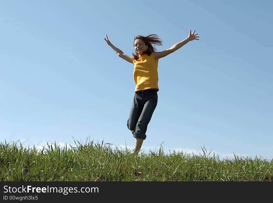 Girl Jumps At Top Of A Hill