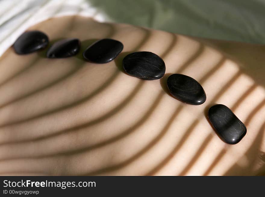 Six black stones for spa-massage on a back. Six black stones for spa-massage on a back