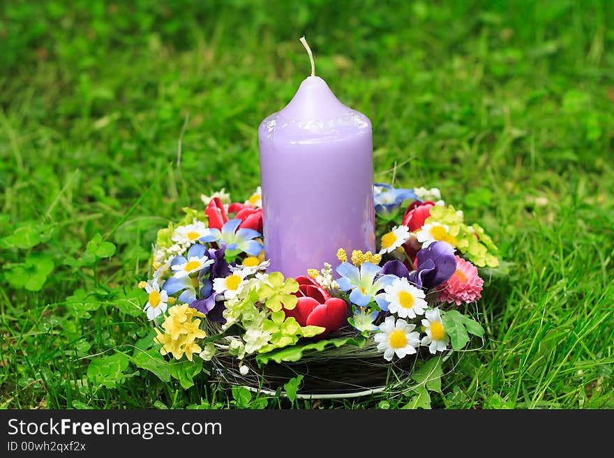 Easter decoration and candle in the garden