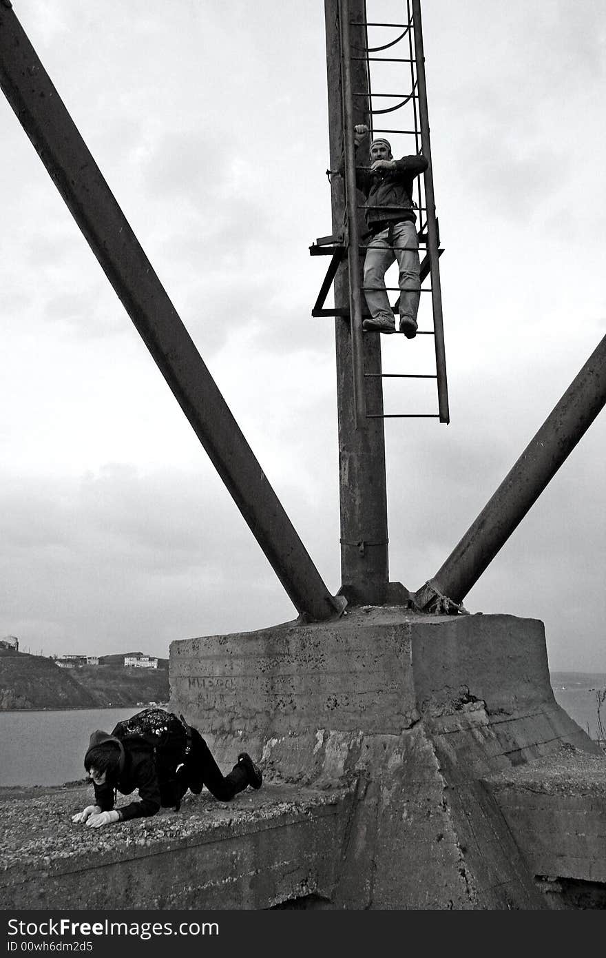 Girl kissing ground. She get down from the tower. Boys now lowering on the stairs. Girl kissing ground. She get down from the tower. Boys now lowering on the stairs.