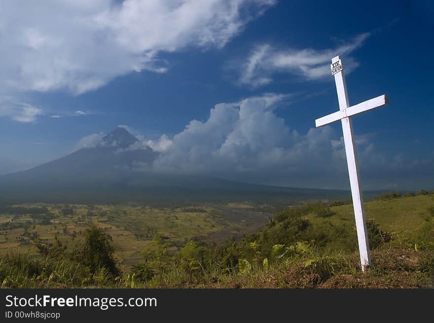 A station of the cross set in front of a volcano. A station of the cross set in front of a volcano