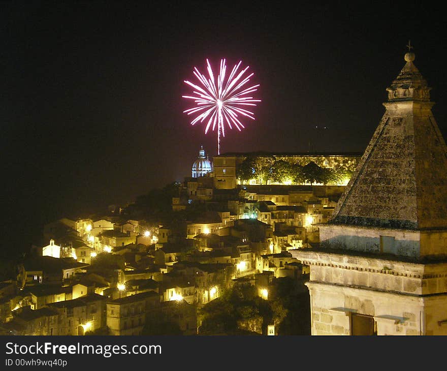 The photo represents at night Ragusa, a splendid Sicilian city and its characteristic it is that we have succeeded in taking the exact instant in which the fire of artifice explodes. The photo represents at night Ragusa, a splendid Sicilian city and its characteristic it is that we have succeeded in taking the exact instant in which the fire of artifice explodes