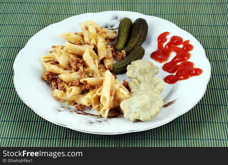 Macaronis with meat, vegetables and sharp sauce. Macaronis with meat, vegetables and sharp sauce