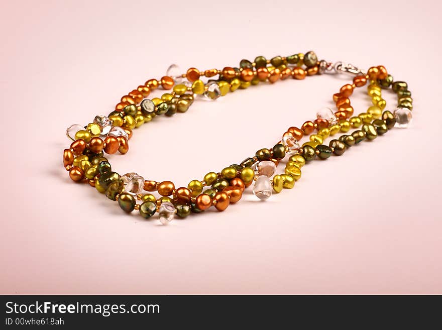 A necklace on pink background