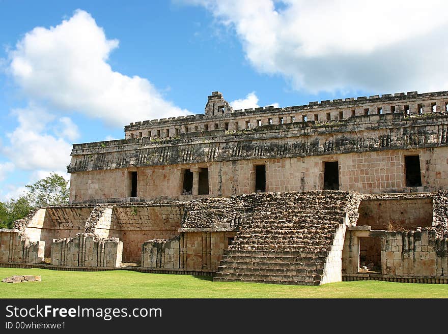 Maya ruins with antique columns over blue sky. Maya ruins with antique columns over blue sky