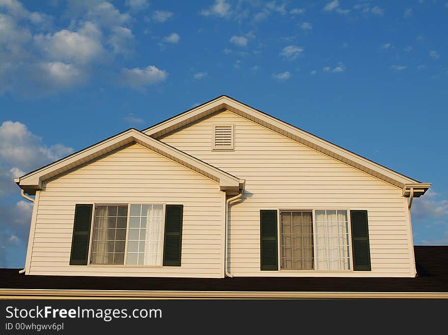 Front of a home with a blue sky. Sharp focus over the entire image. Front of a home with a blue sky. Sharp focus over the entire image.