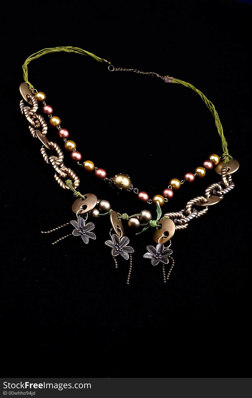 A necklace on black background