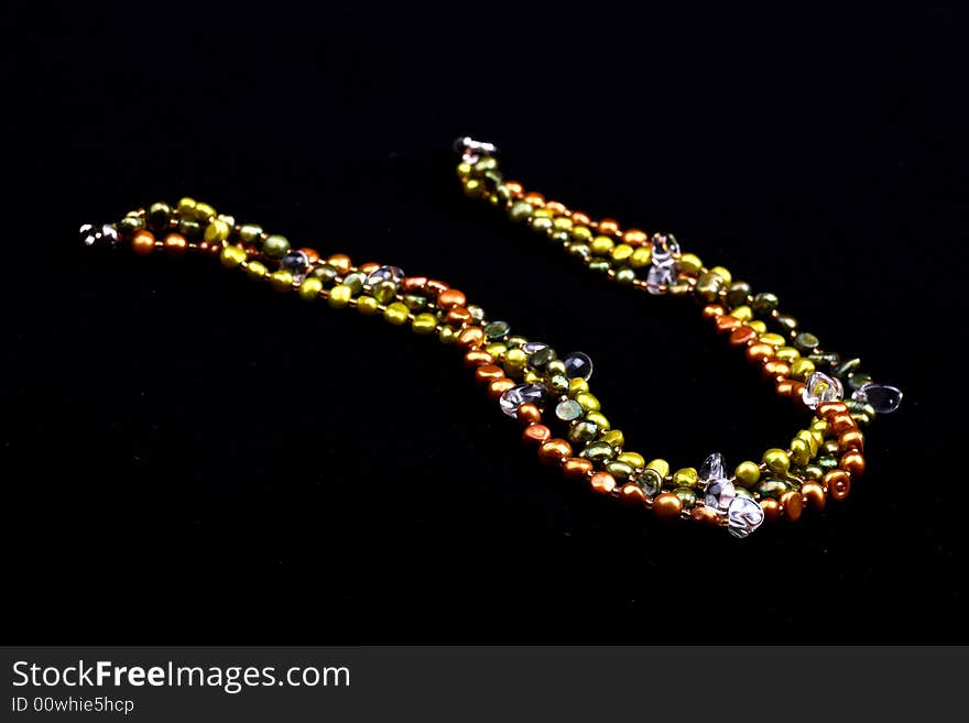 A necklace on black background