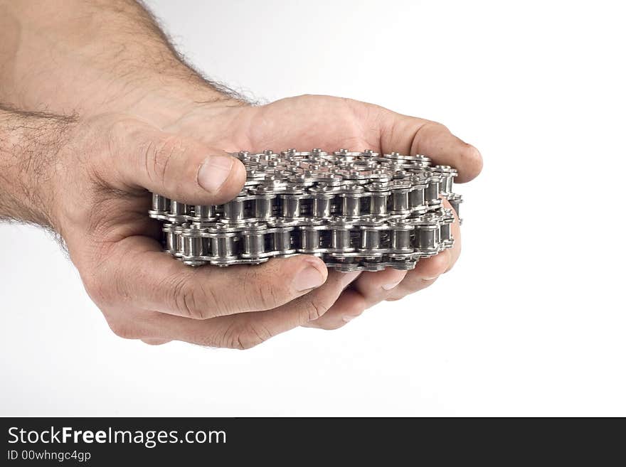 Hands with metal link chain on a white