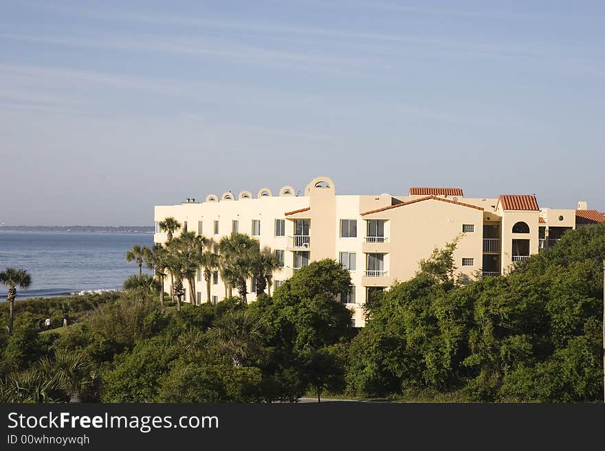 A set of colorful condominiums on the coast across a park. A set of colorful condominiums on the coast across a park