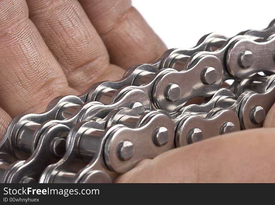 Hand with metal link chain- close up