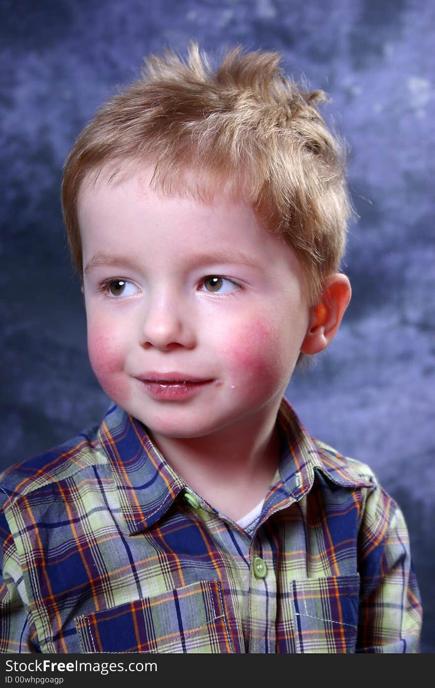 Studio portrait of a young boy. Studio portrait of a young boy.