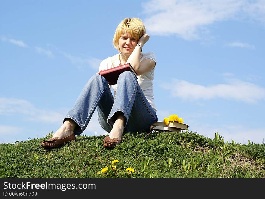 Female student outdoor on green grass