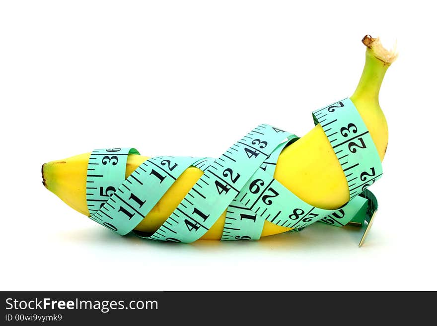 Green tape measure wrapped around a banana. Green tape measure wrapped around a banana