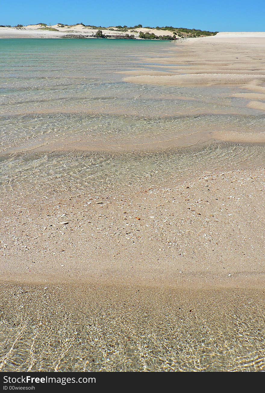 Deep ripples in the sand are filled with water It is low tide at the mouth of a creek in the Kimberlie region of North-West Australia. Deep ripples in the sand are filled with water It is low tide at the mouth of a creek in the Kimberlie region of North-West Australia.