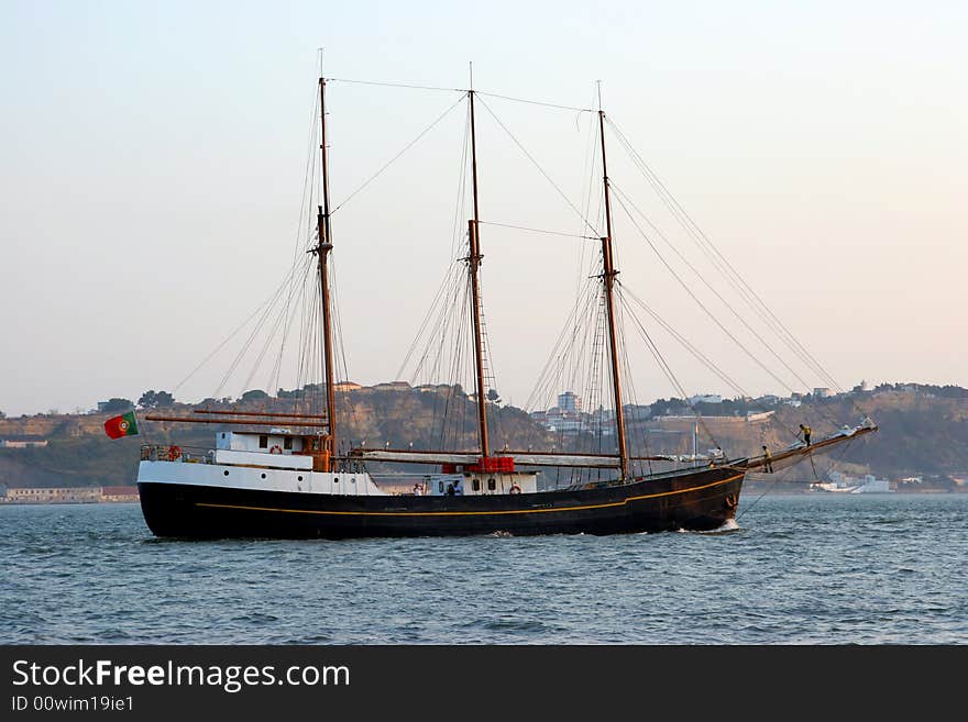 Portuguese sailing boat exiting the harbor. Portuguese sailing boat exiting the harbor