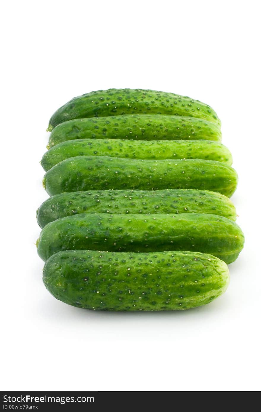 Green cucumbers isolated on white. Green cucumbers isolated on white