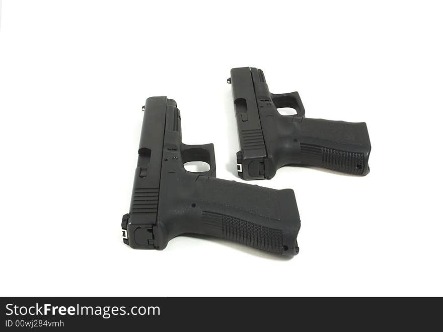 2 black handguns isolated on a white background. 2 black handguns isolated on a white background