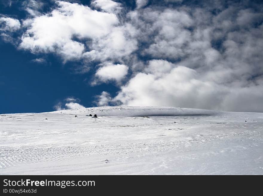 Mountain slopes with white snow