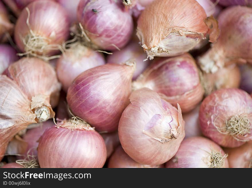 Pile of onions on a market