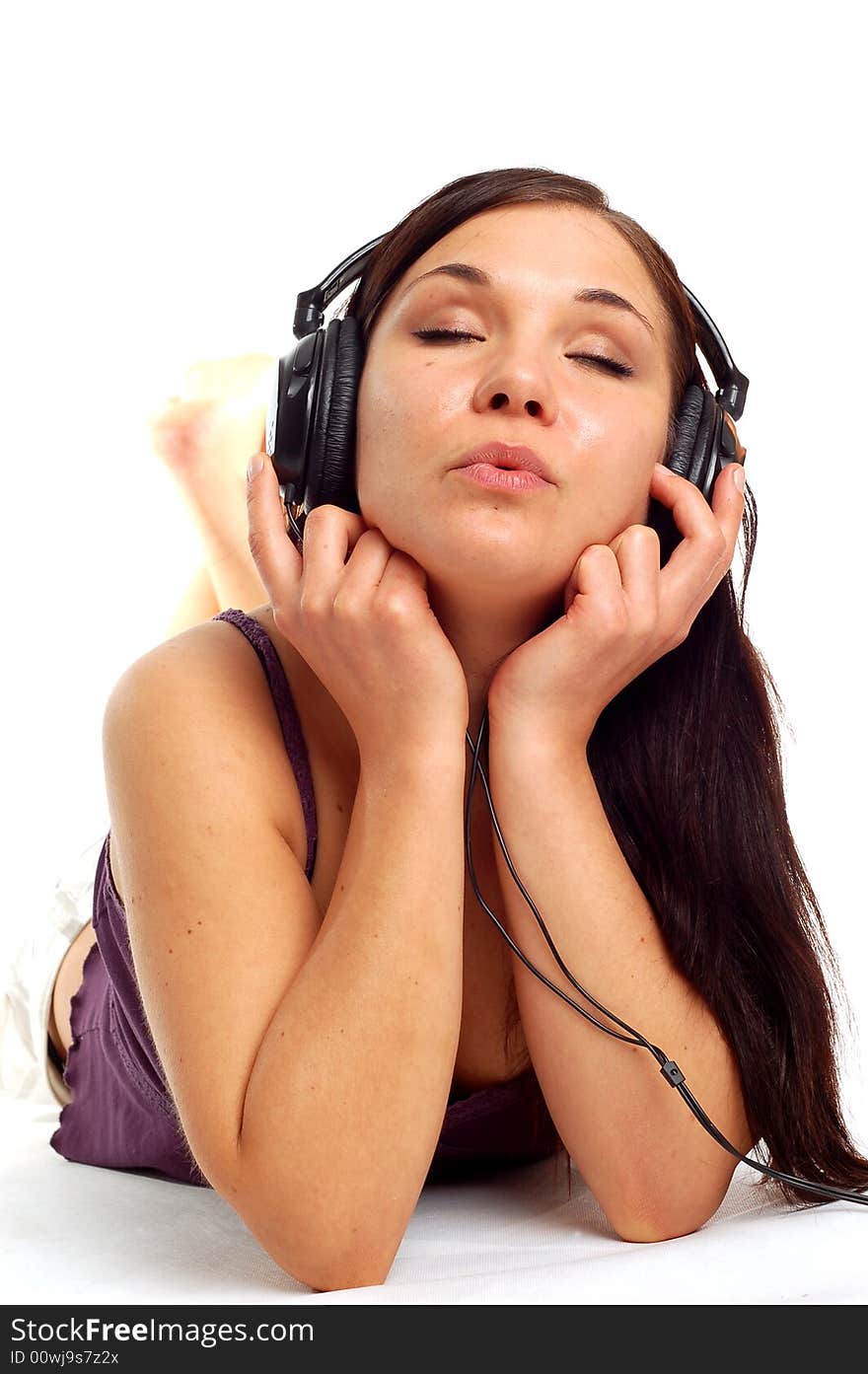 Attractive brunette woman with headphones. Attractive brunette woman with headphones