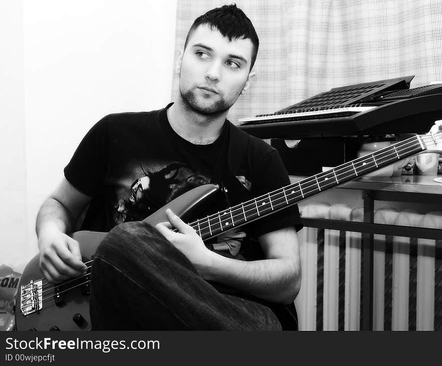 Portrait of young men close up with guitar. Portrait of young men close up with guitar