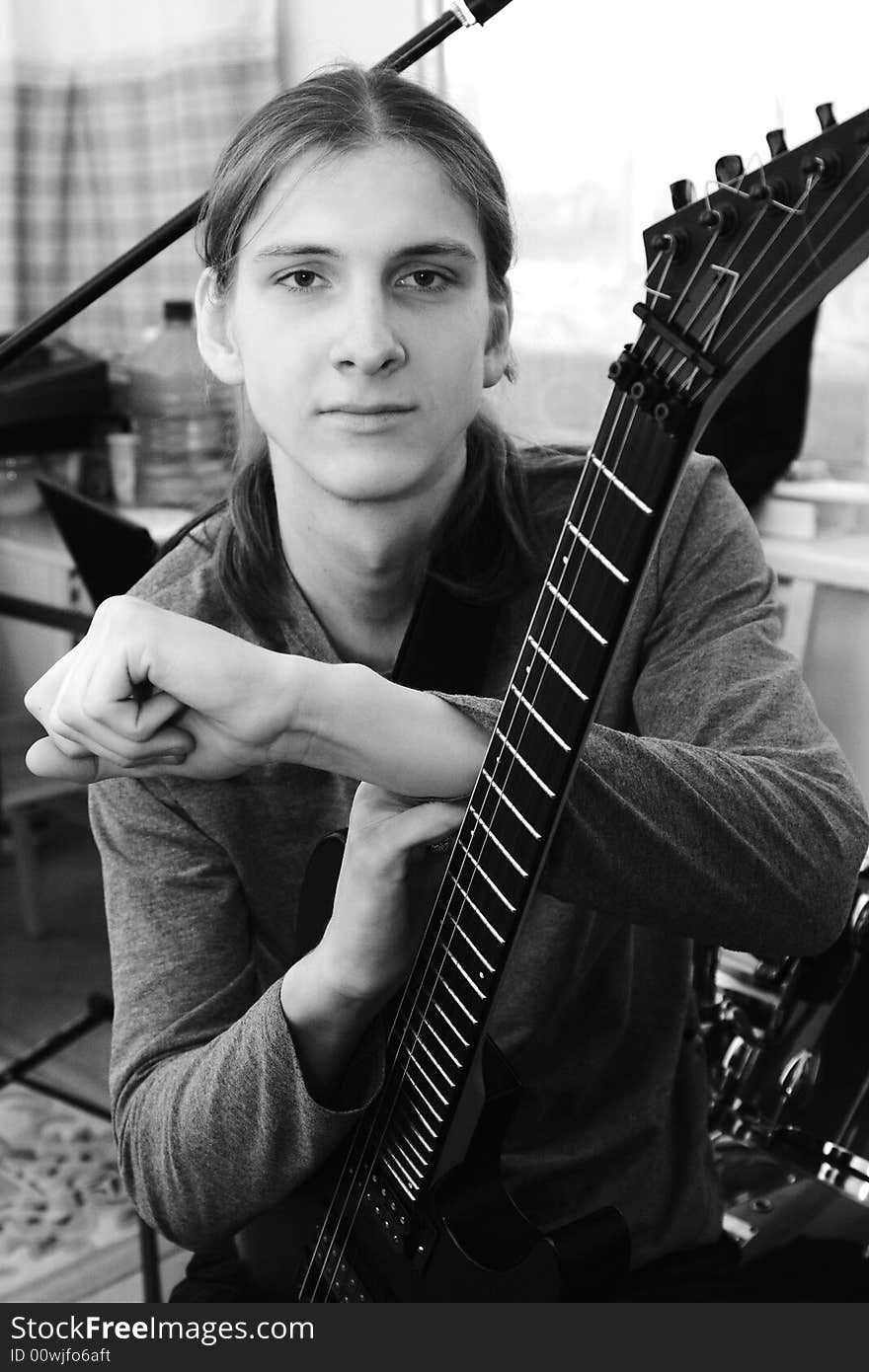 Portrait of young men close up with solo guitar. Portrait of young men close up with solo guitar