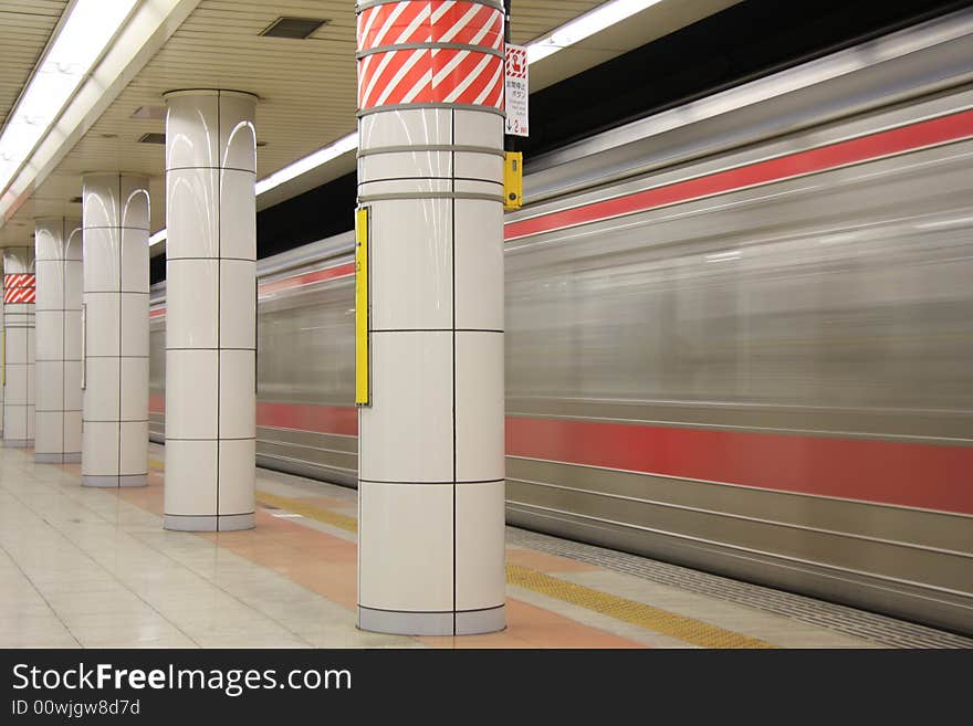 A long time shutter speed photograph of a underground train passing by the station in Tokyo. A long time shutter speed photograph of a underground train passing by the station in Tokyo.