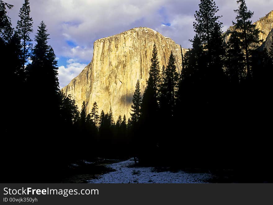 El Capitan at sunset with reflections of warm light off the rock cliffs