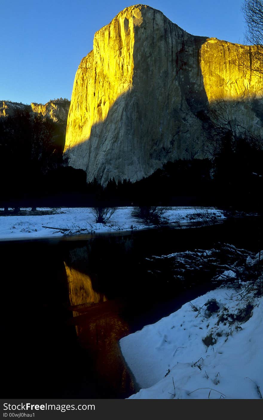 El Capitan at sunset with reflections of warm light off the rock cliffs