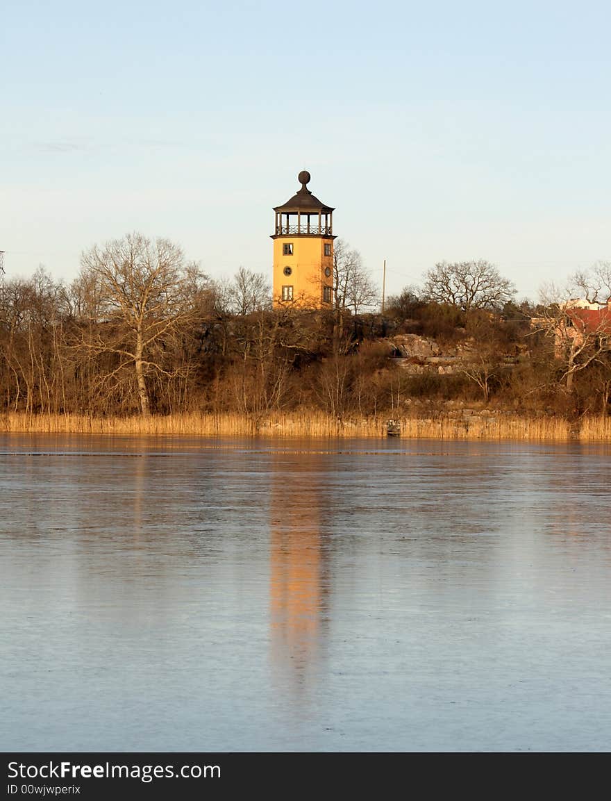 Lighthouse in the winter waiting for darkness to serve