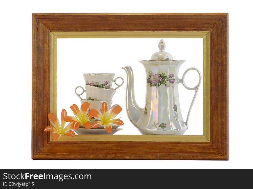 Teapot and cup within the framework against the white background. Teapot and cup within the framework against the white background