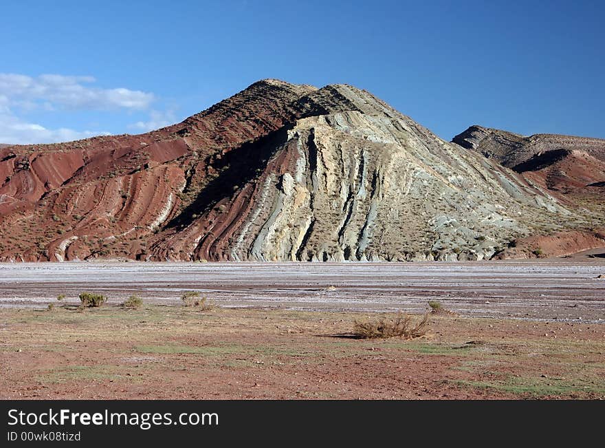 Geological feature of a hill with colorful purple gravel. Altiplano. Bolivia. Geological feature of a hill with colorful purple gravel. Altiplano. Bolivia.